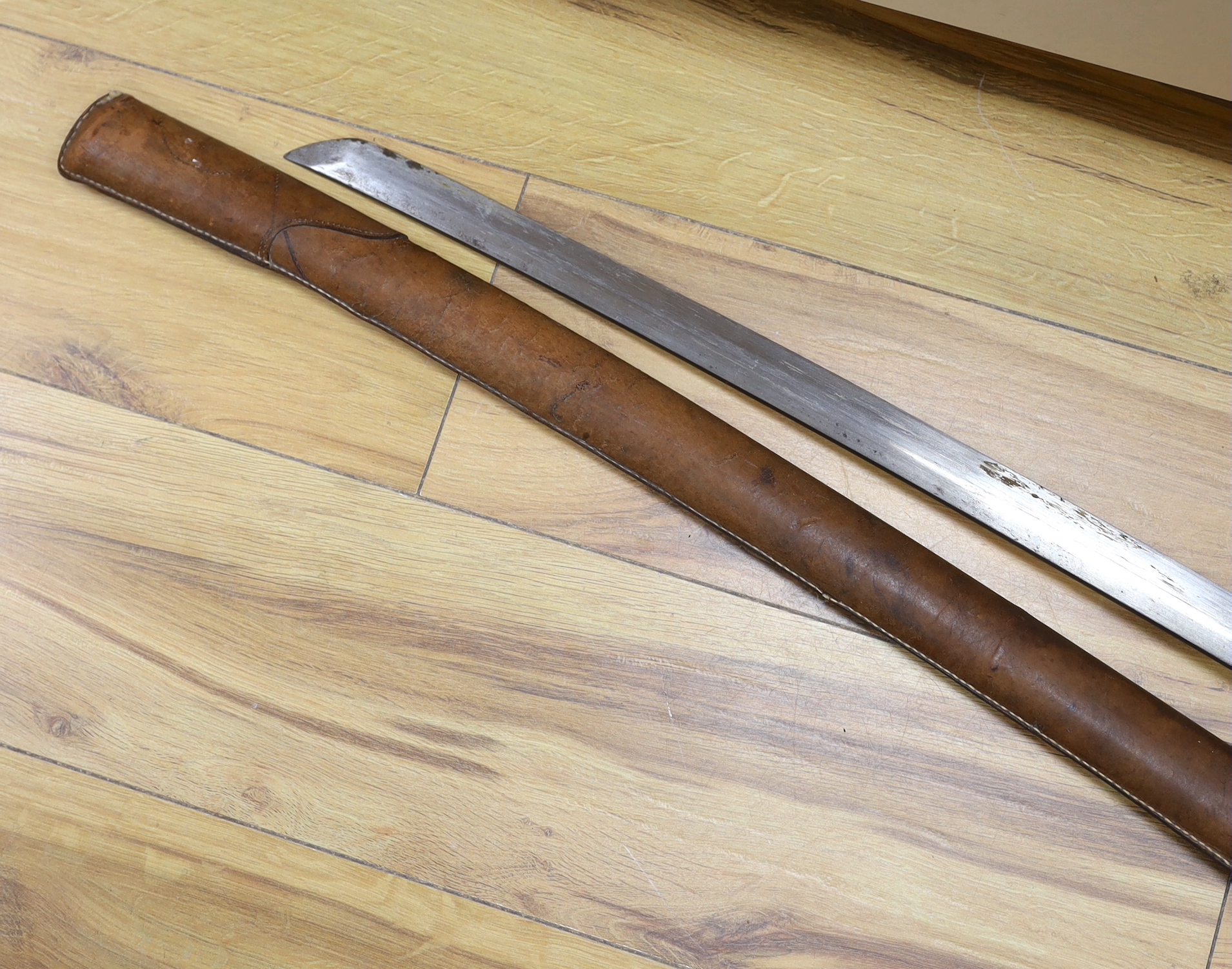 A Japanese WWII Shin gunto (sword) and leather mounted scabbard